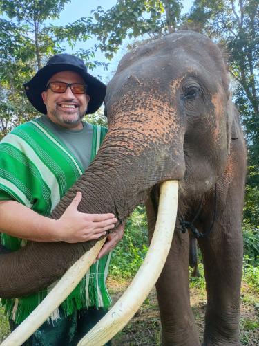Phillip Howard visits with an elephant