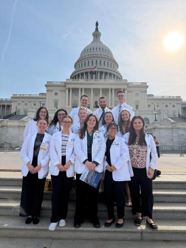 HCOM students pose in front of the Capitol in Washington D.C.