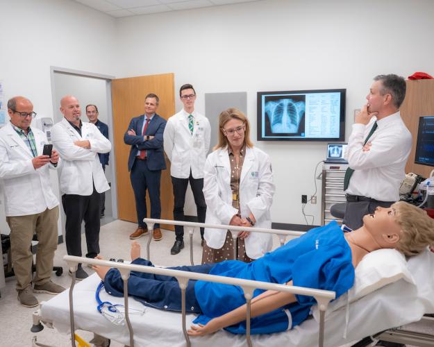 Ohio Rep. Beryl Brown Piccolantonio looks at mannequin in clinical skills training