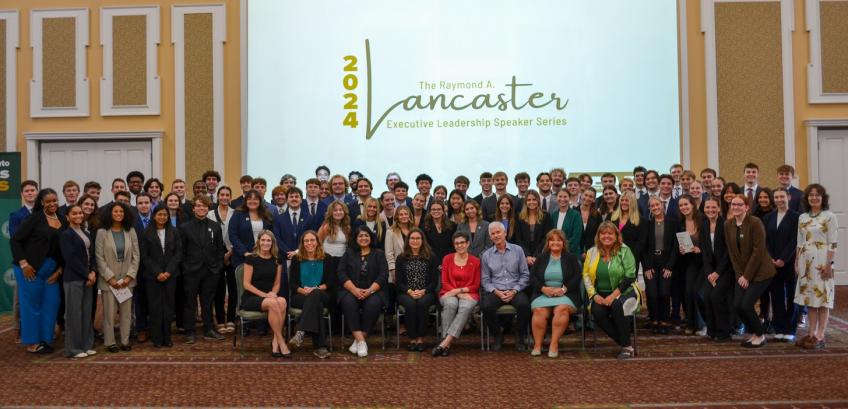 Audience members and speakers pose for a group photo at the Raymond A. Lancaster Executive Leadership Speaker Series event in the Baker Ballroom