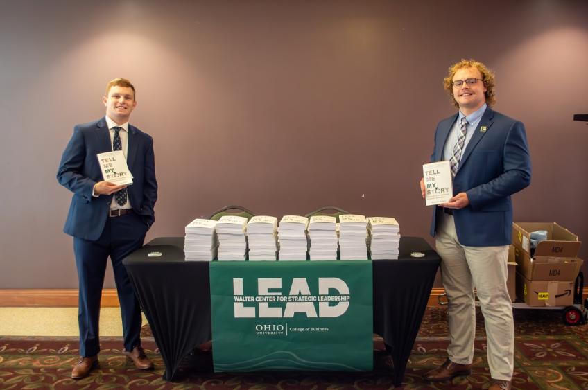 OHIO students from the Walter Center for Strategic Leadership show off copies of the book, "Tell Me My Story."