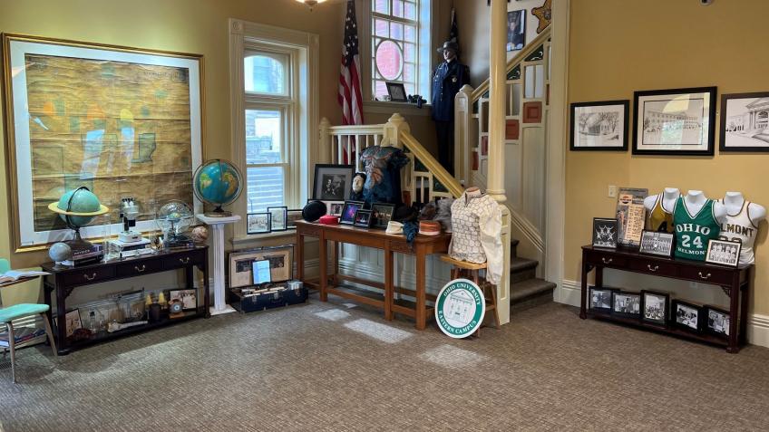 A collection of tangible historical items on display in a museum to showcase the history of Ohio Univeristy Eastern academic programs.