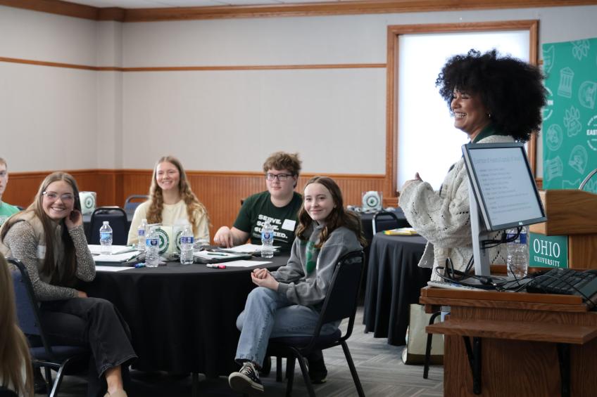 students sitting around tables at events