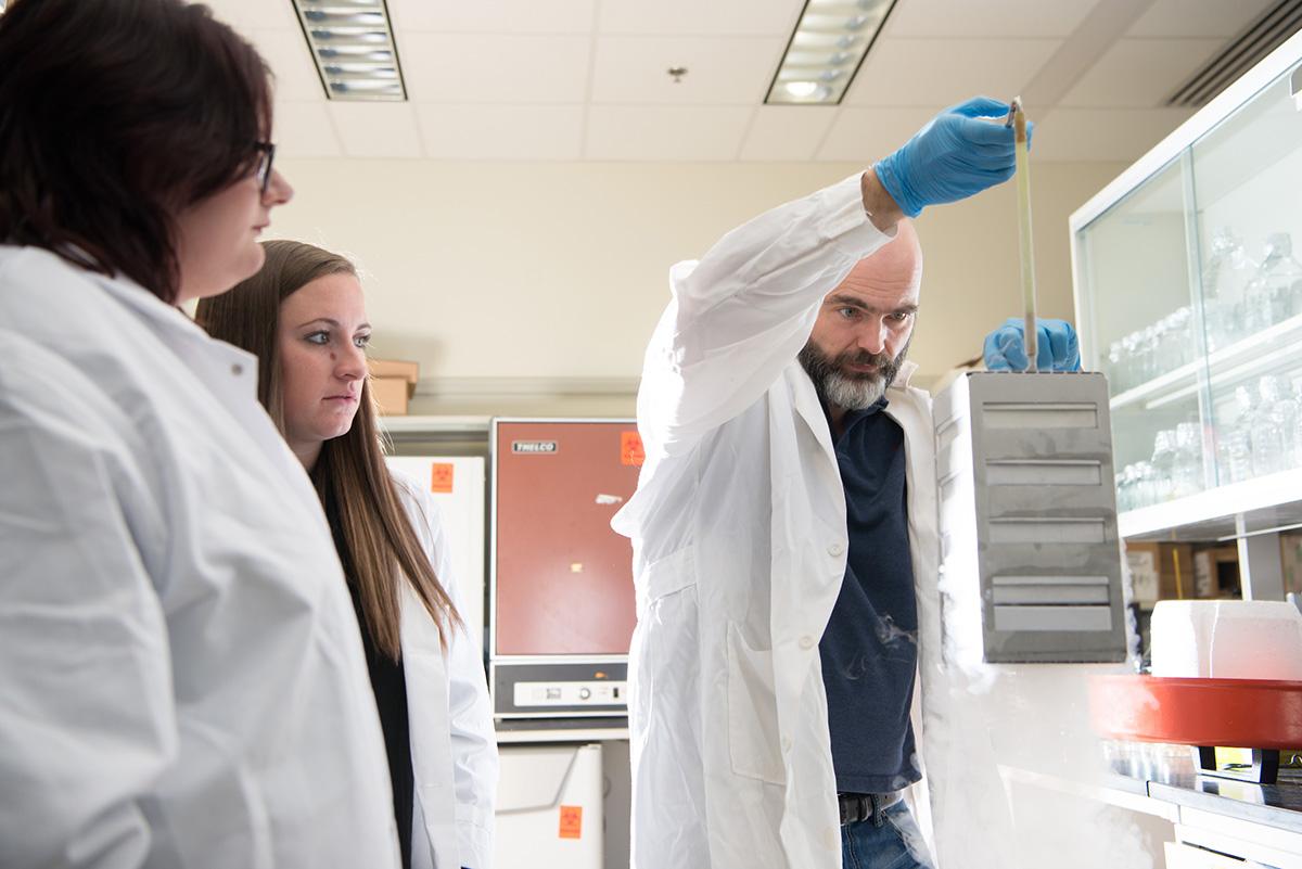 Dr. Ronan Carroll  with lab students