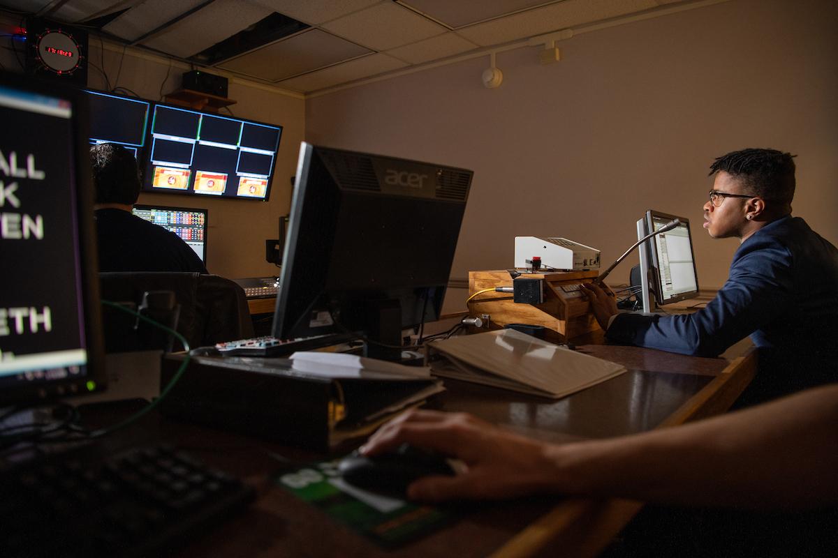 Journalism student Ethan Sands produces a promo video for Hardwood Heroes, a sports journalism program run by students at WOUB. Photo: Ben Siegel