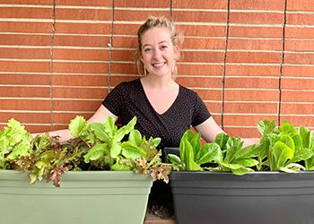 Bryce Lemaster is pictured in May 2019 on the rooftop garden that was installed at Hocking Valley Bank.