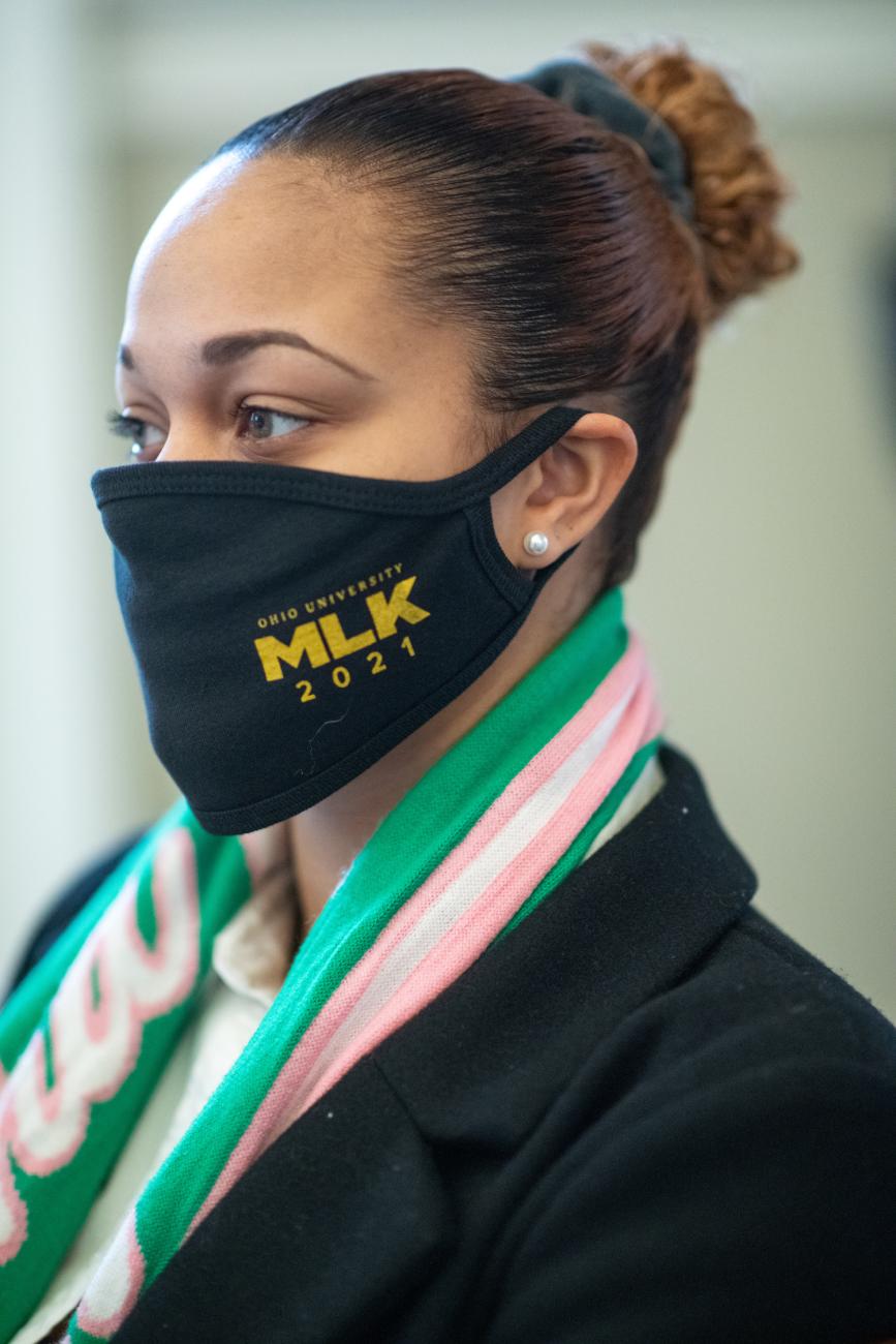 Ohio University student Taj Haley attends the Silent March.