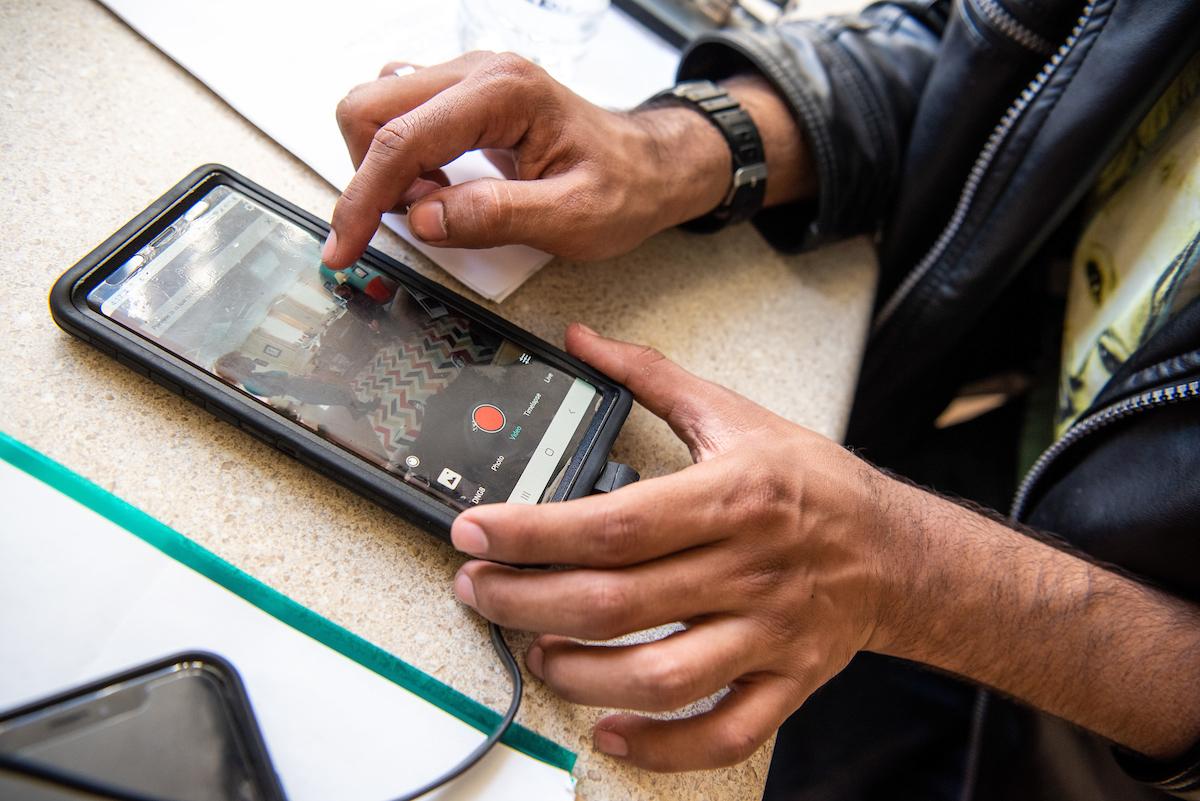 A student moves a camera remotely using his phone