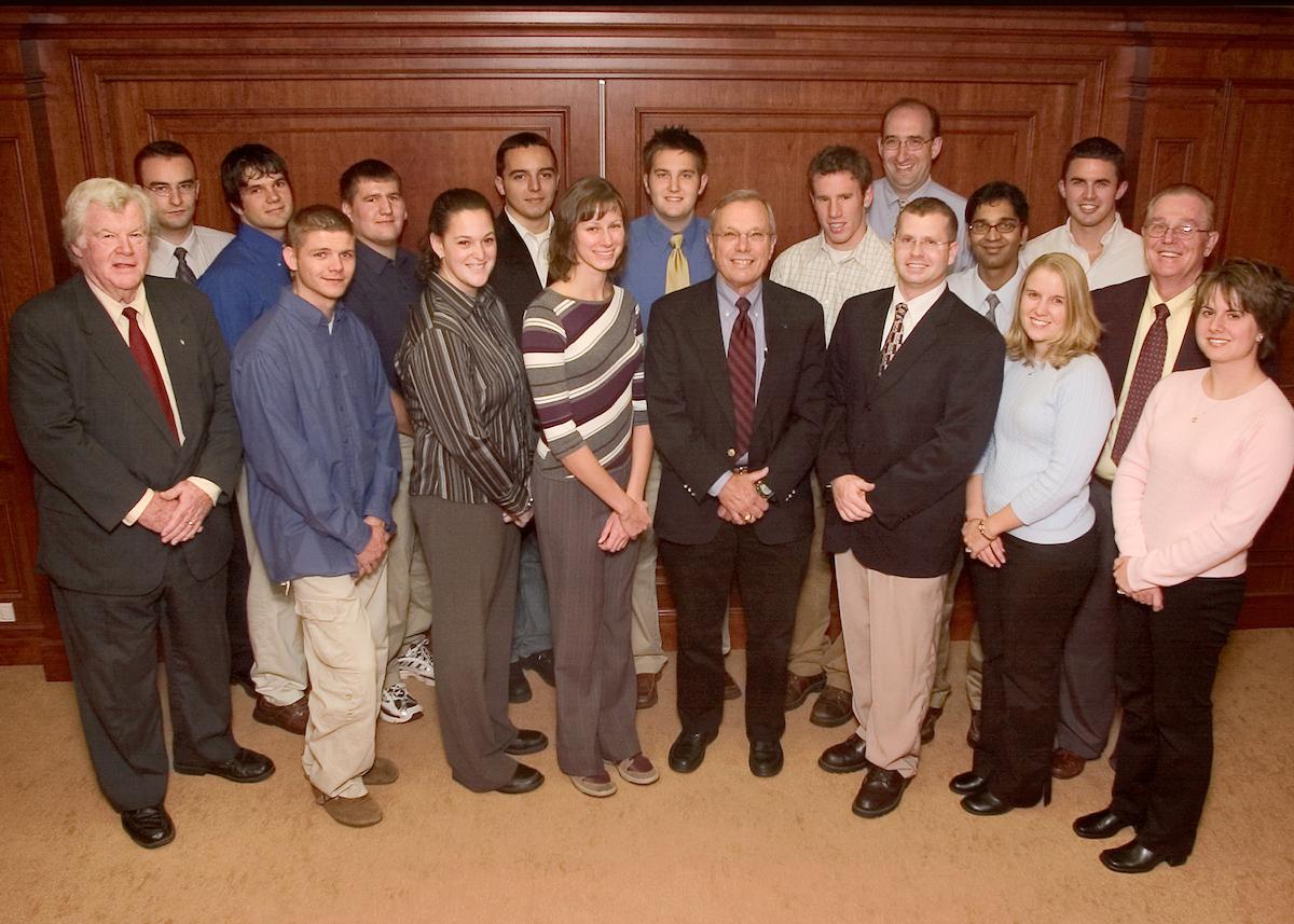 Dean Robe stands with students in the Robe Leadership Institute in 2004