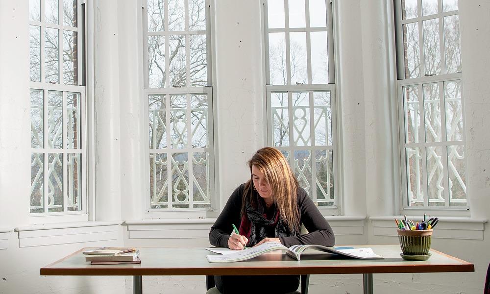 A photo of Shawna Wolfe inside one of the buildings at The Ridges