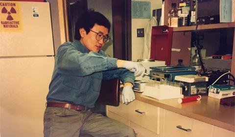 Young Dr. Jon Wang working in the lab at Ohio University