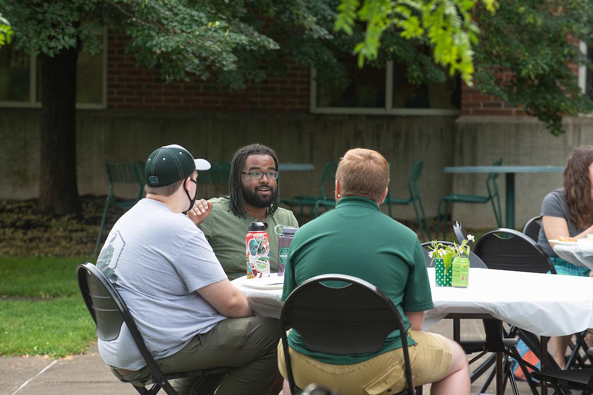 Staff chat during the end of year event.