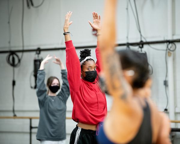 Visiting Artist Cara Hagan, works with first year dance students, including Najah Carson in a Modern 1 dance class