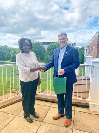 Professor Margaret Keraka is welcomed to OHIO by Interim Dean John McCarthy.