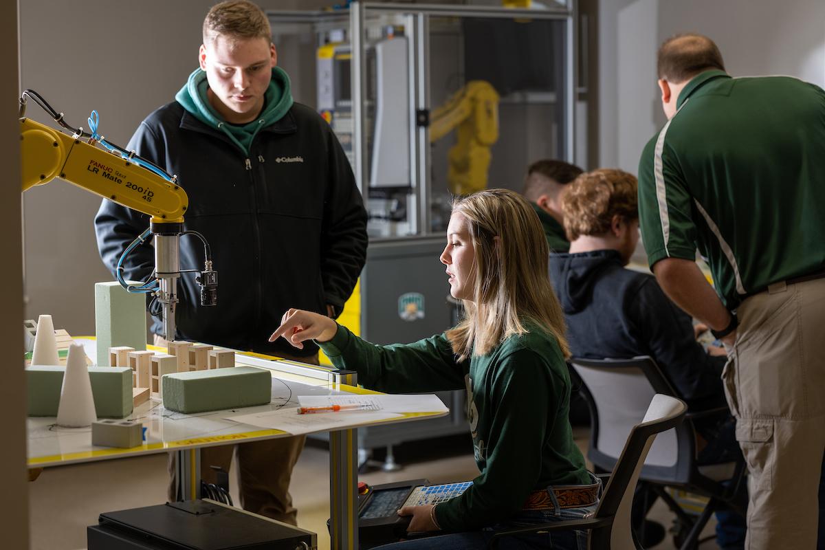 Student uses robot at Fairfield Workforce Development Center