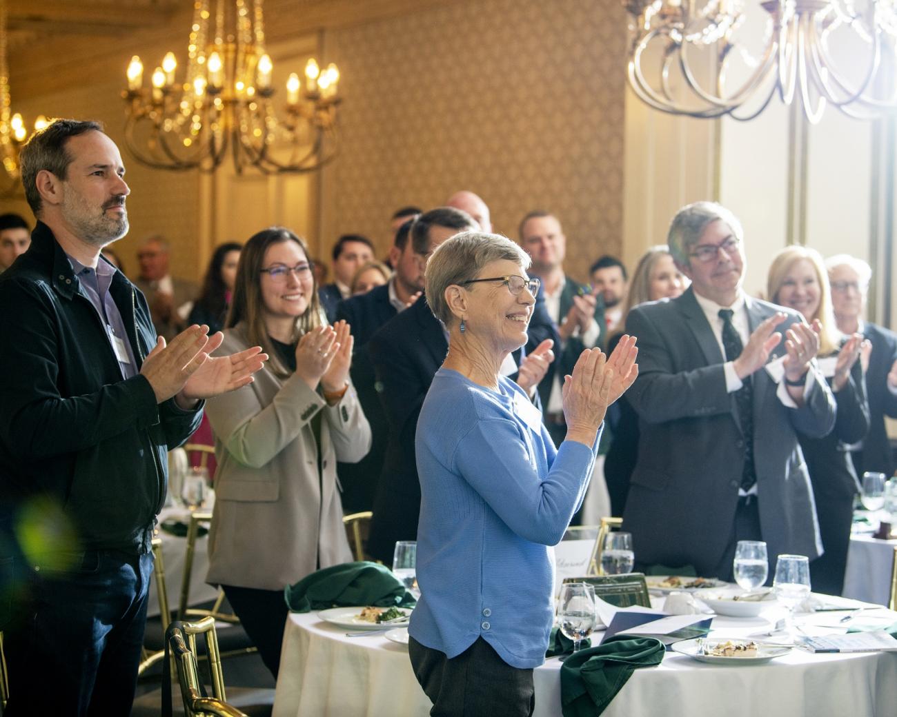 The audience gives Mark Weinberg a standing ovation