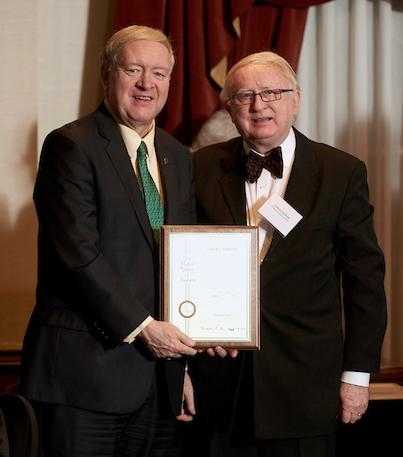 Duane Nellis and Tadeusz Malinski holding an award