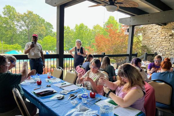 Workshop at Shawnee State Park Lodge, held on a shaded porch.