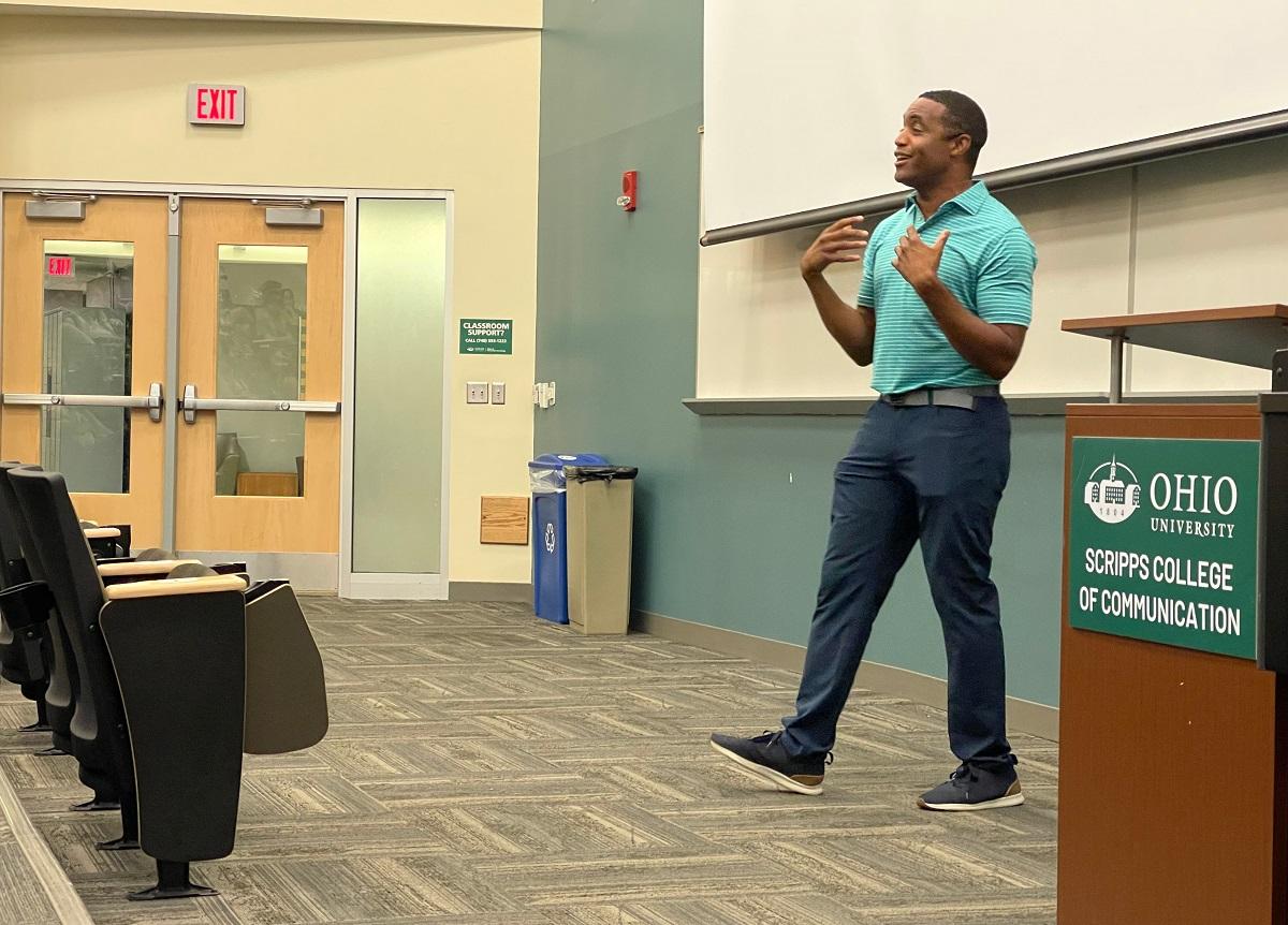 Matt Barnes is shown speaking at the High School Journalism Workshop