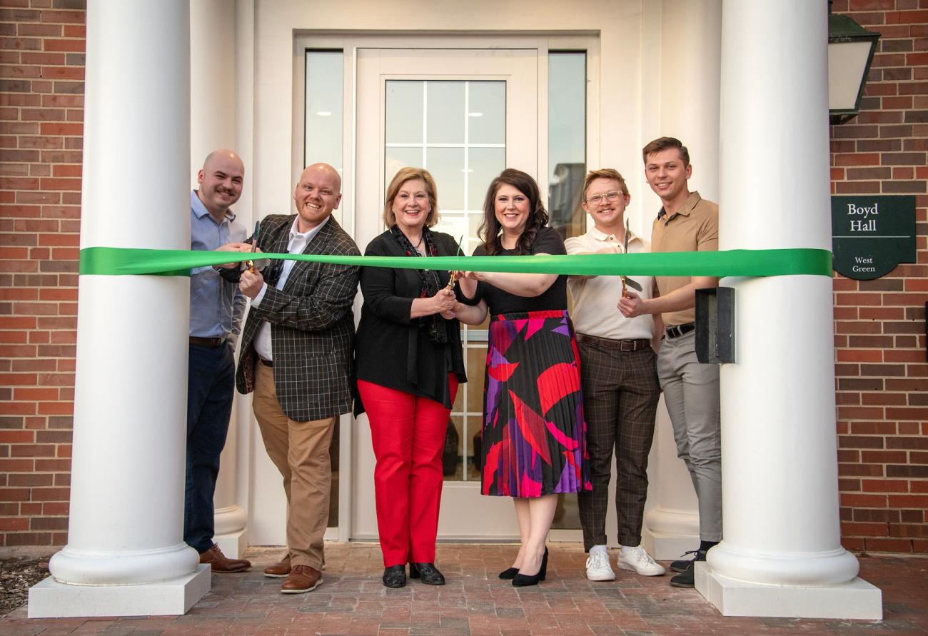 OHIO representatives get ready to cut the ribbon at the Grand Opening Ceremony outside of Boyd Hall