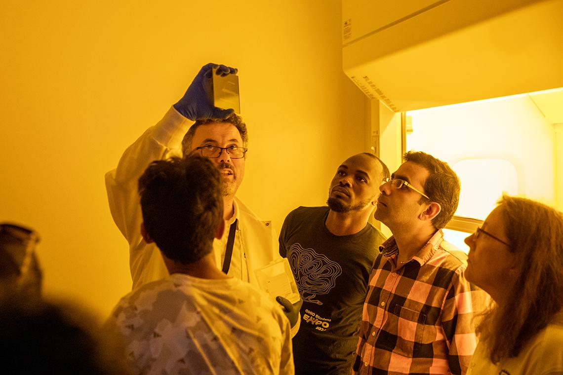 Participants of the ASCENT Semiconductor Workshops learn about the steps involved in wafer fabrication processing as well as clean room operations and chip packaging during demonstrations held at the Russ Research Opportunity Center on the Ohio University campus in Athens, Ohio on June 11, 2024.