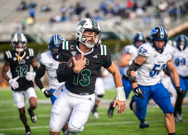 An OHIO football player runs with the ball.