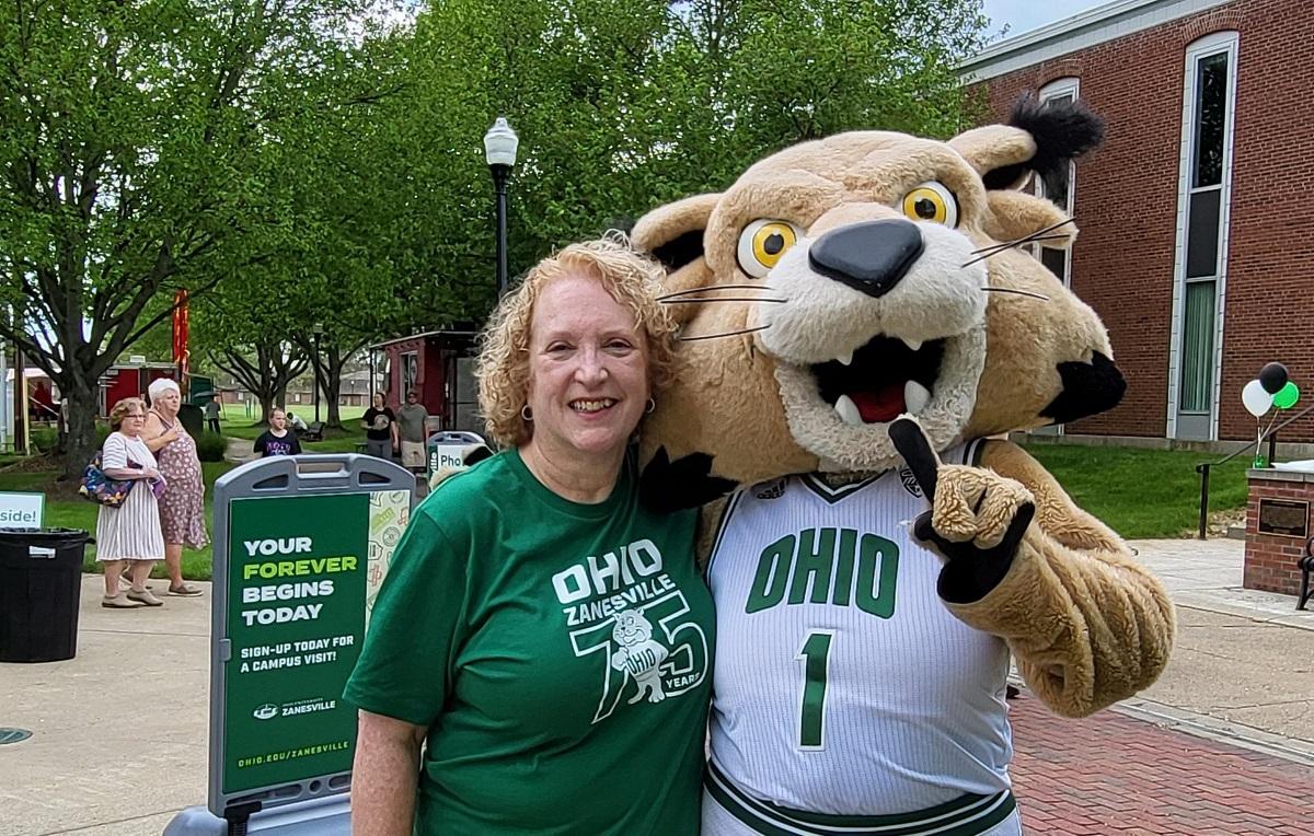 Hannah Nissen and Rufus are shown outside at the OHIO Zanesville Campus