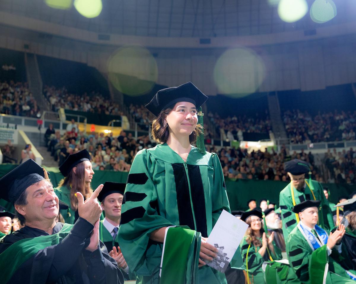 HCOM student is recognized during commencement