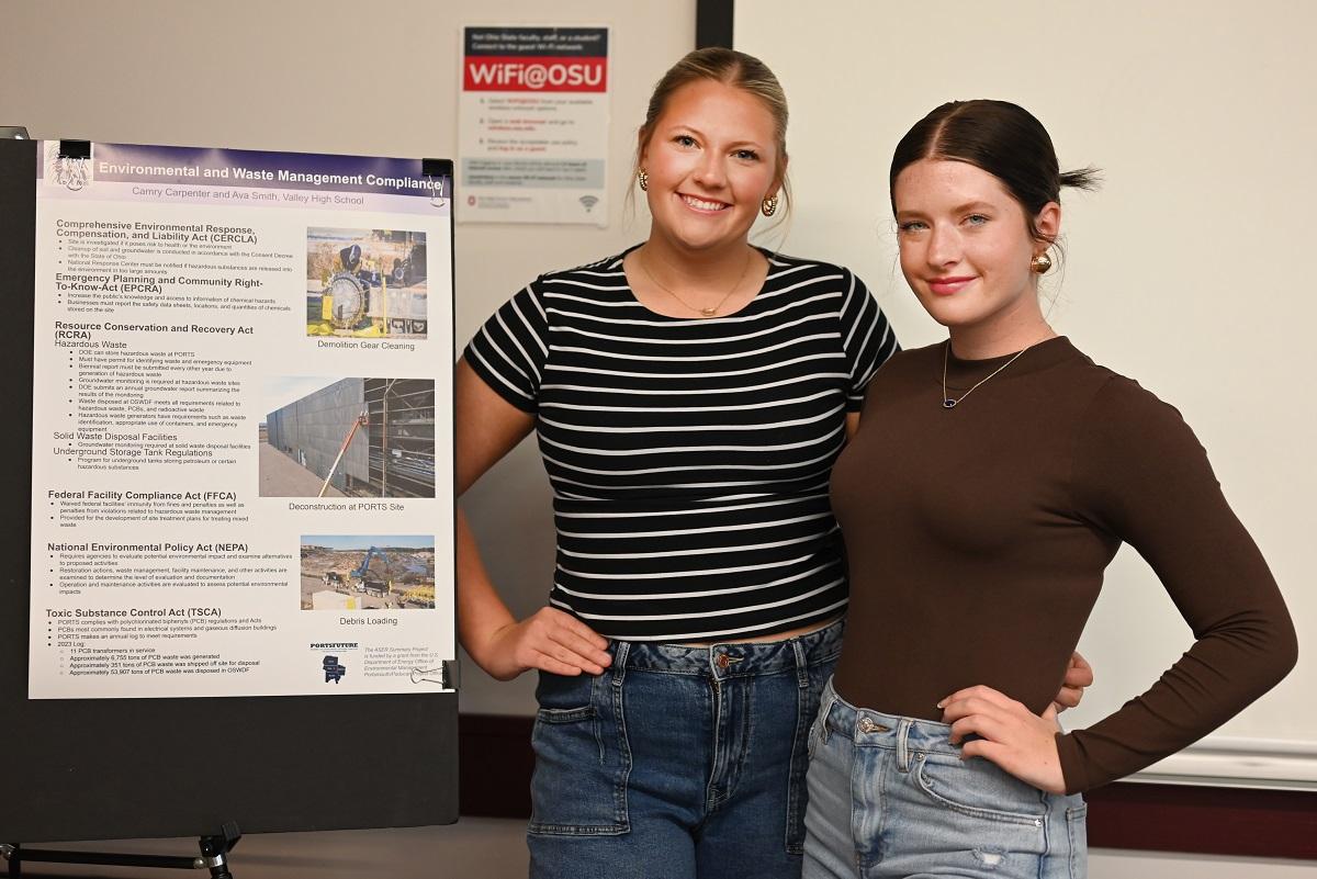 Two students stand by their project at the ASER Student Summary Project Student Expo 
