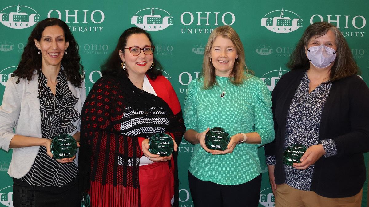 Victoria LaPoe, Maria Postigo, Linda Rice and Kathleen Sullivan are shown holding their awards
