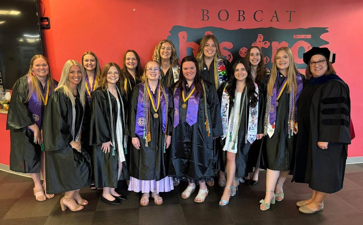 OHIO Lancaster graduates and an OHIO Leader pose for a photo at the Graduation Recognition Ceremony