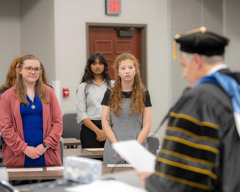 Phi Beta Kappa students stand at the 2025 initiation ceremony.