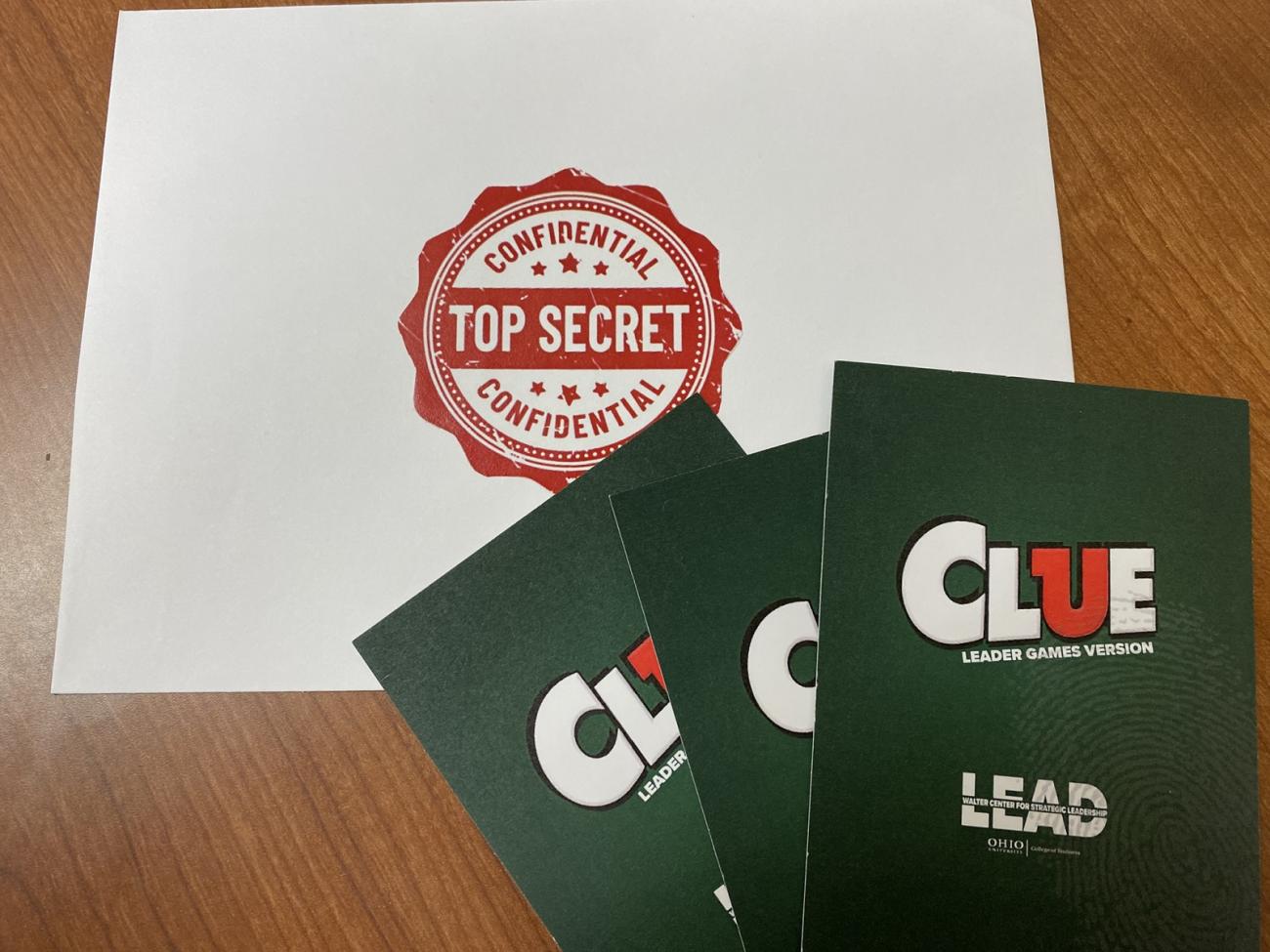 Papers from the game that say Confidential - Top Secret - Clue