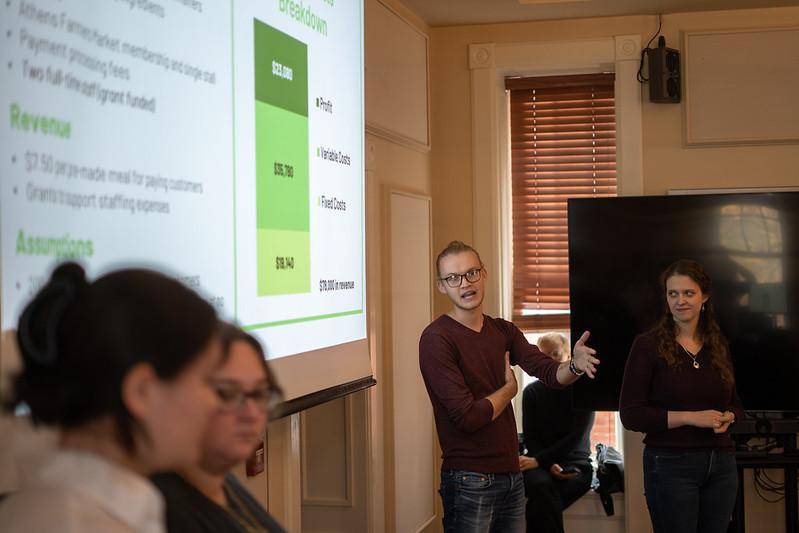 An OHIO graduate student leads a presentation