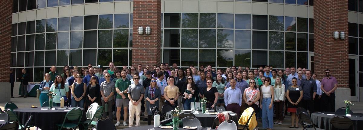 Division of Student Affairs staff stand in front of the Ping Center
