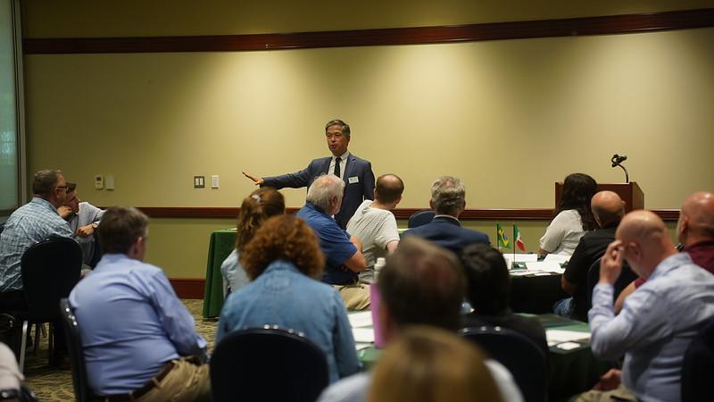 Dean Matthew Ando speaks to the crowd at the conference