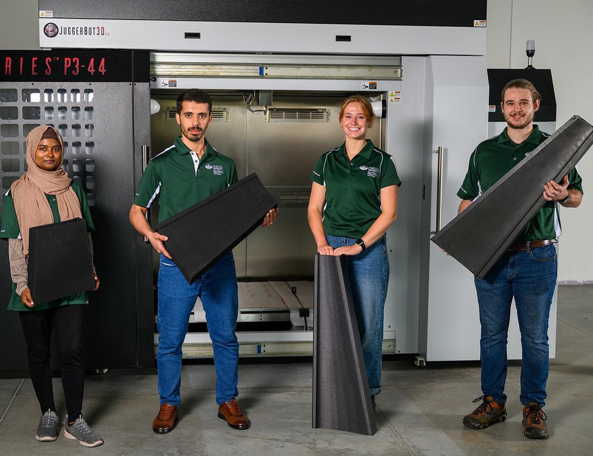 Students hold sustainable carbon materials.
