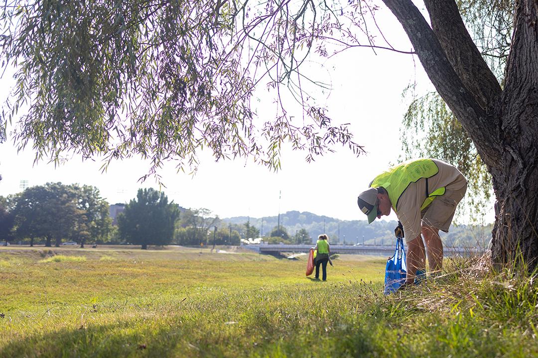 Volunteers collect trash from the Hocking River at the 2024 Ohio River Sweep on the Hocking.