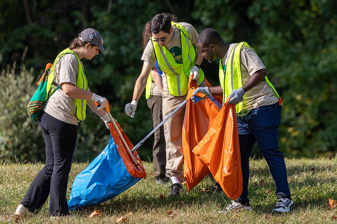 Volunteers collect trash from the Hocking River at the 2024 Ohio River Sweep on the Hocking.
