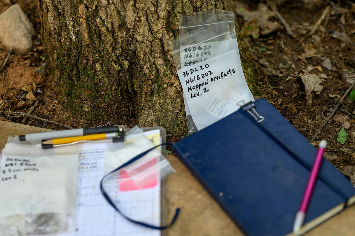 Closeup of research journals at an archeological dig