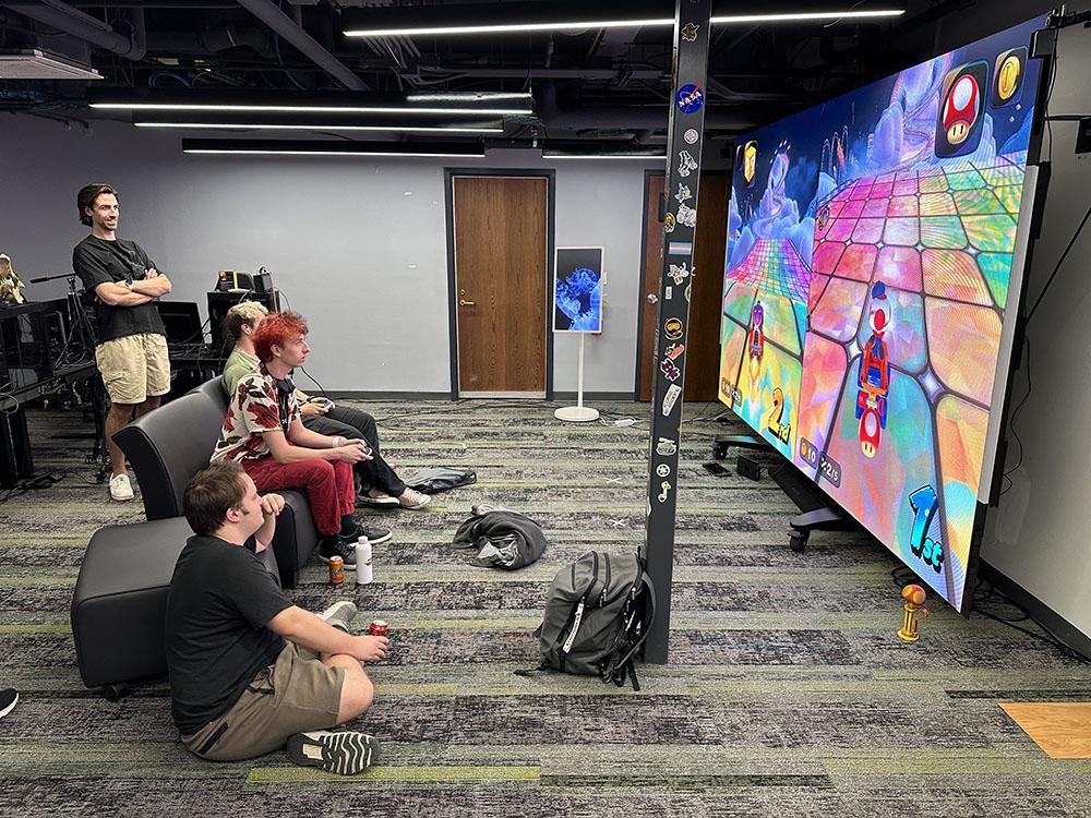 Gamers play their digital version of the golf tournament at E.W. Scripps Hall on the Athens campus