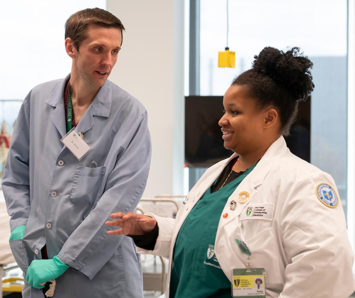 HCOM medical student and faculty help participants during Medical Student for a day