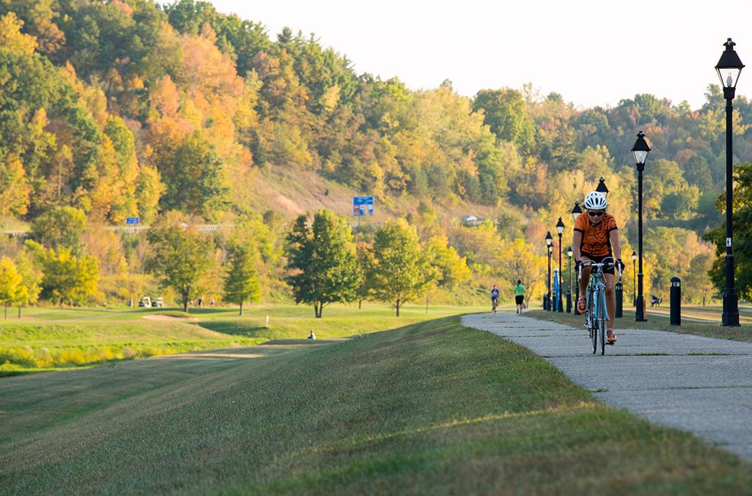 A cyclist utilizes the Hockhocking Adena Bikeway.
