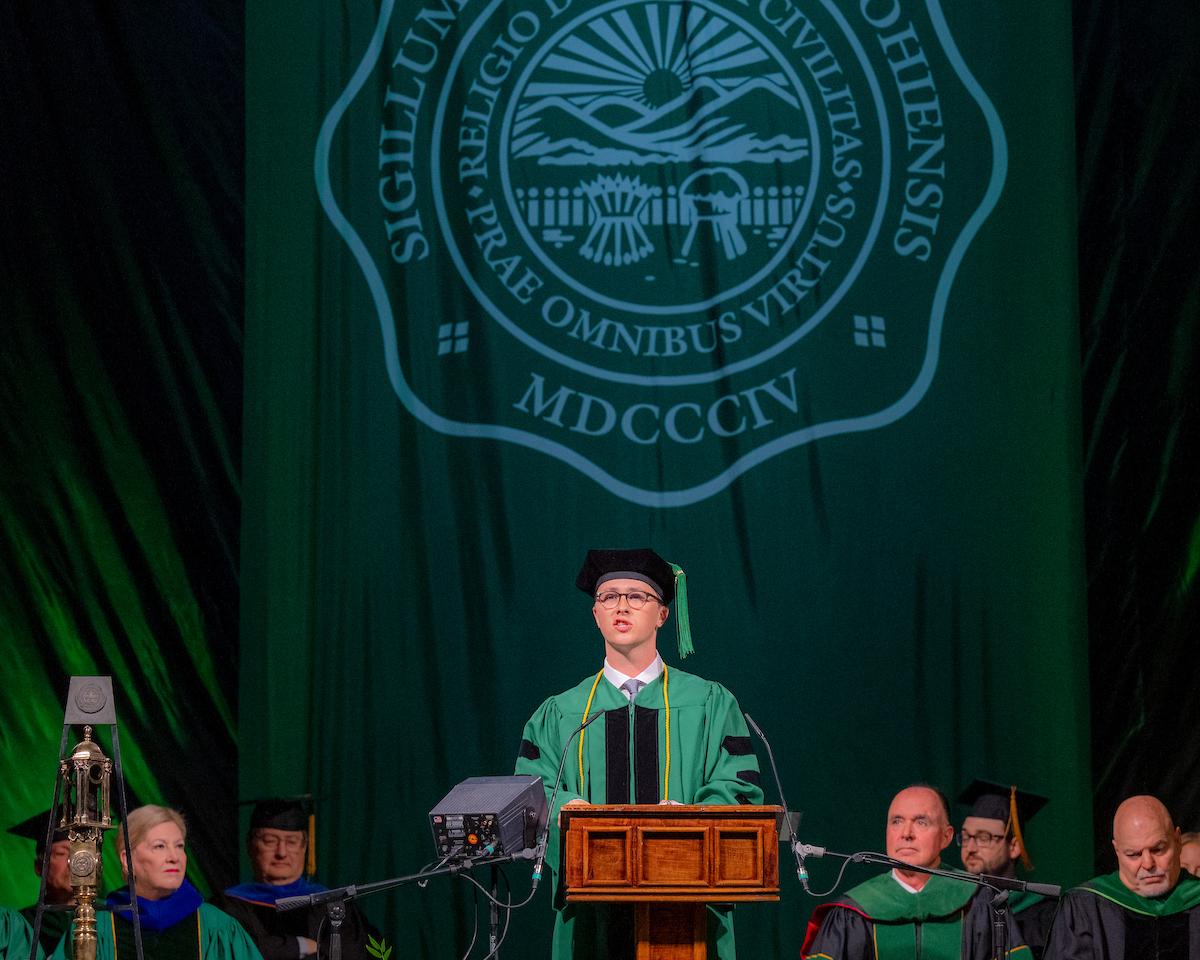 Student speaker Jonathan Peters talks at HCOM commencement.