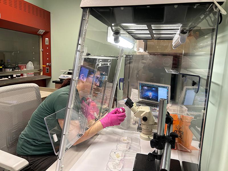 Recent OHIO graduate Lara Fogwell loads experiment hardware to be sent to the ISS. The launch is currently slated for May 12.