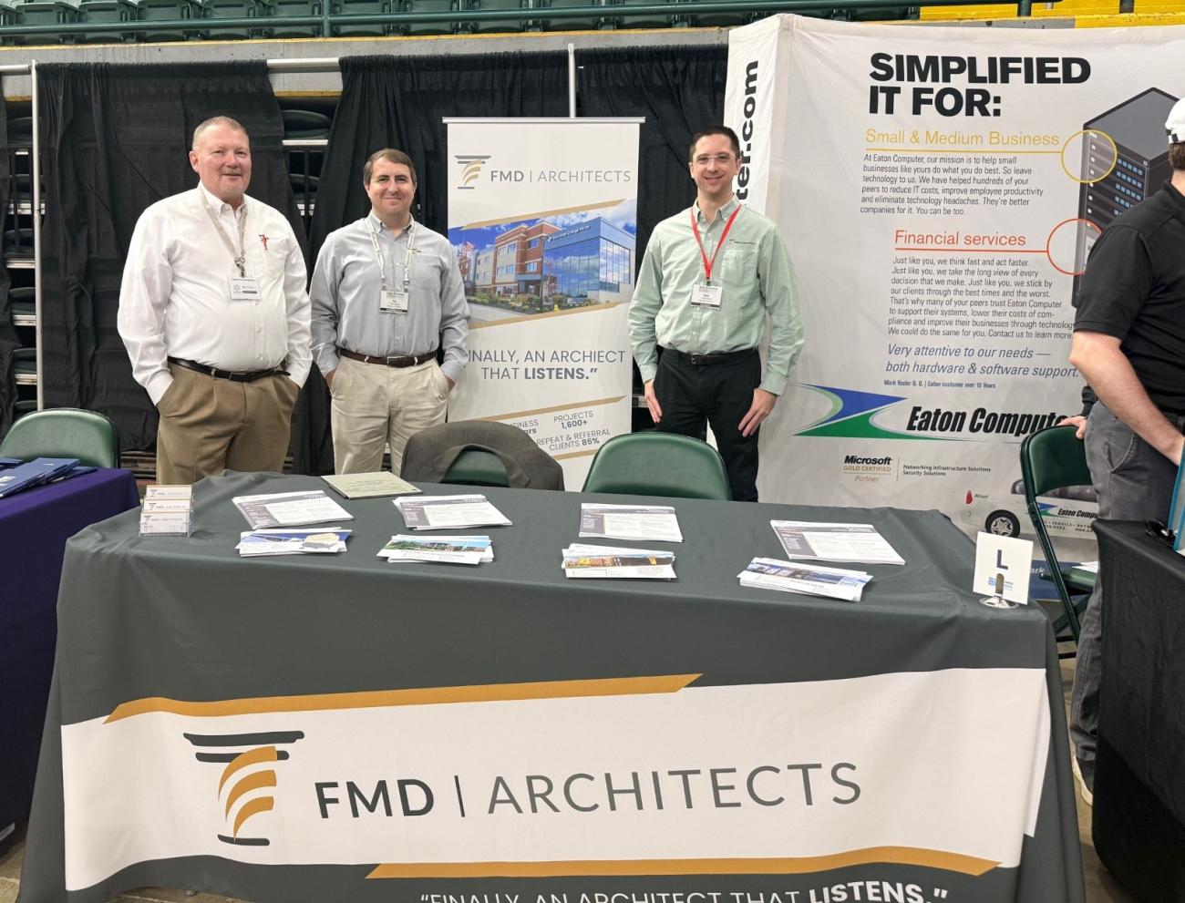 Representatives of FMD Architects stand behind their booth at the Ohio Business Matchmaker event