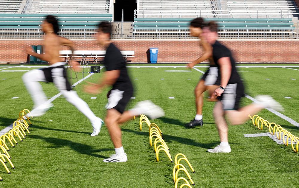 OHIO Football players practice on the field at Peden Stadium
