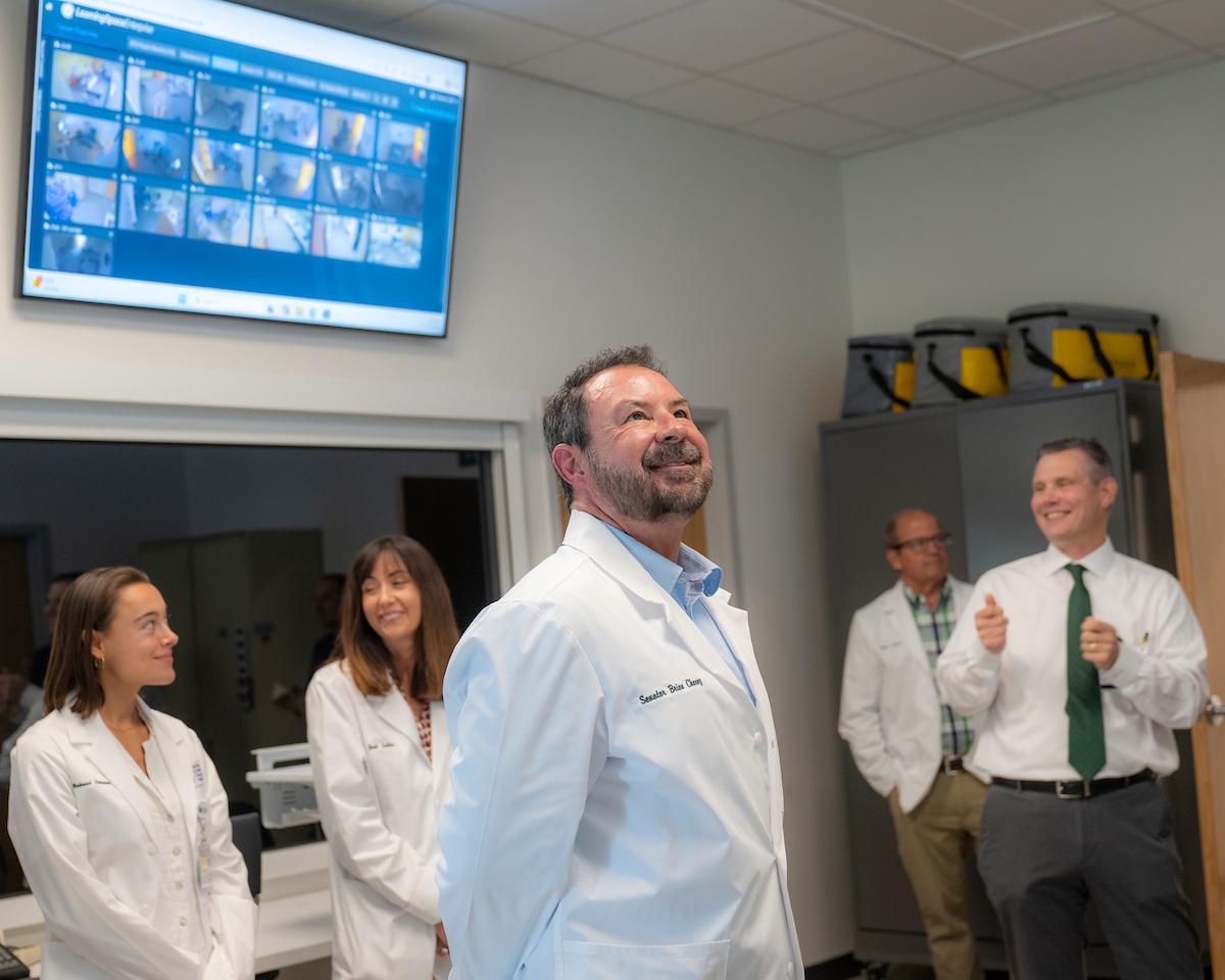 Sen. Brian Chavez looks at screens in the clinical skills lab
