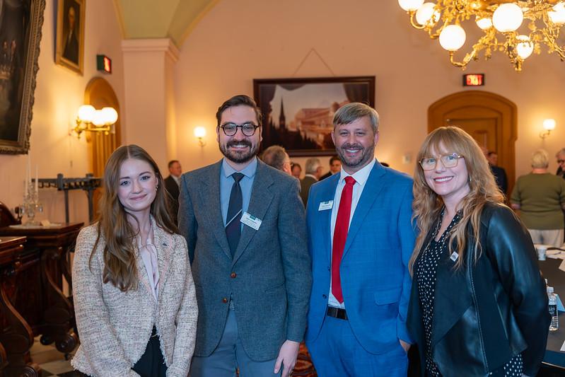 Emily Stokes stands with members of the Mayors Partnership for Progress
