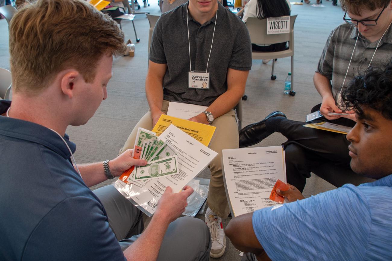HCOM students gather in groups for Rethinking Poverty experience
